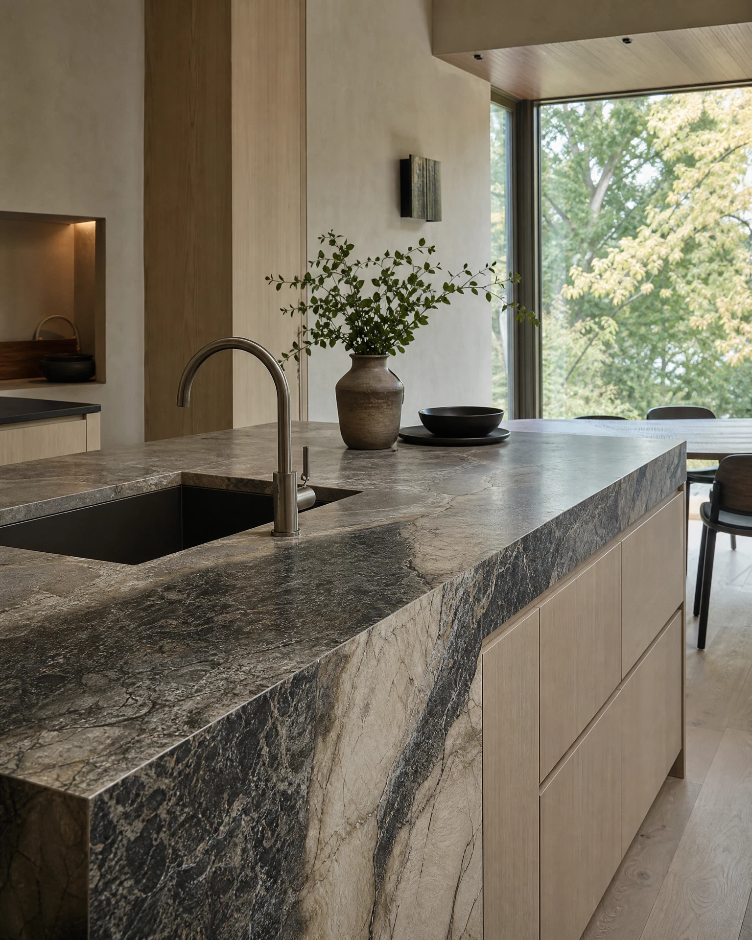 Completed Ottawa kitchen project with a dramatic custom natural stone island and honed countertop surface